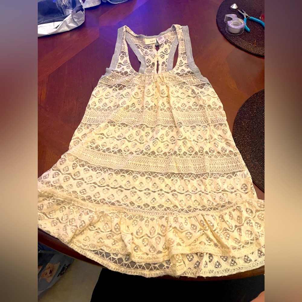 Day Trip Size M sleeveless lace top. See through. Soft with bows on back.